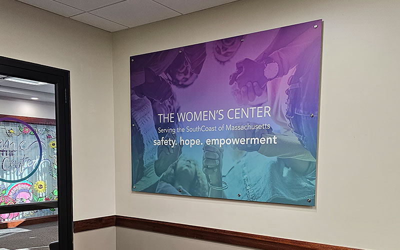 Custom ACM panel sign mounted to wall with standoffs