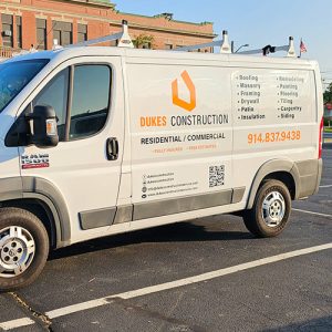 Van with custom graphics for construction company branding
