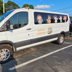 Van with full-color custom graphic wrap