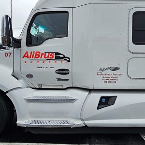 Semi truck branded with large company graphics