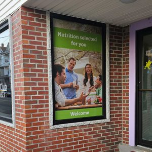 Window Graphics 11 Perforated vinyl graphics applied to windows for advertising