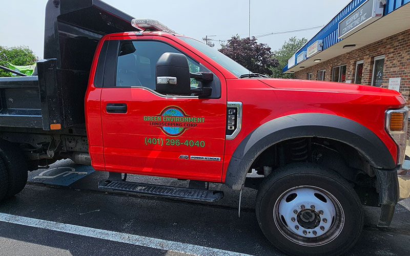 Vehicle Graphics 1 Red landscaping truck with custom company graphics