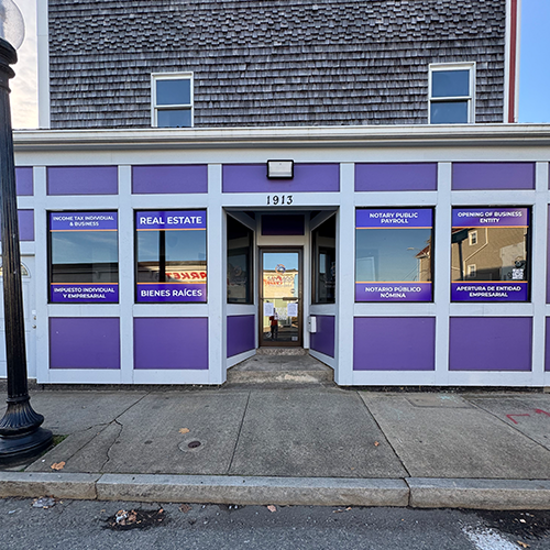 Storefront windows branded with custom vinyl graphics