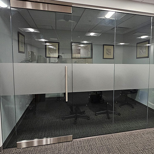 Frosted vinyl graphics on interior office glass partitions